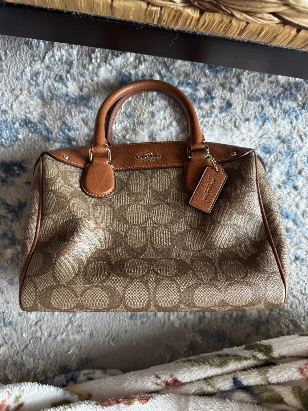 Coach women’s Tan Leather Crossbody Bag with Embossed Logo Patch